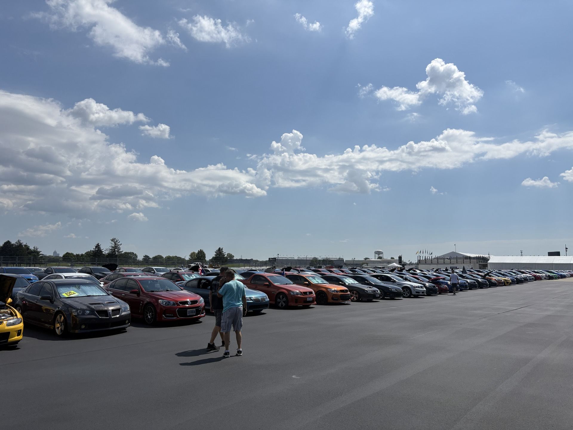 Wide row of Holdens and Chevy SS sedans parked at the Indianapolis Motor Speedway lot