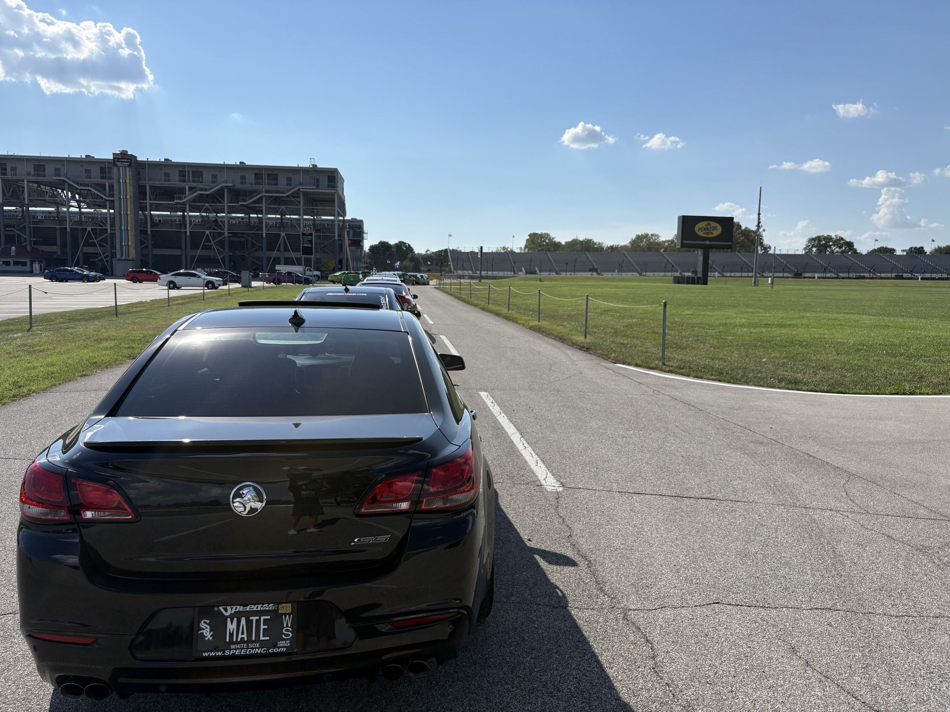 Rear shot of the Chevy SS with its MATE plate driving on the access road