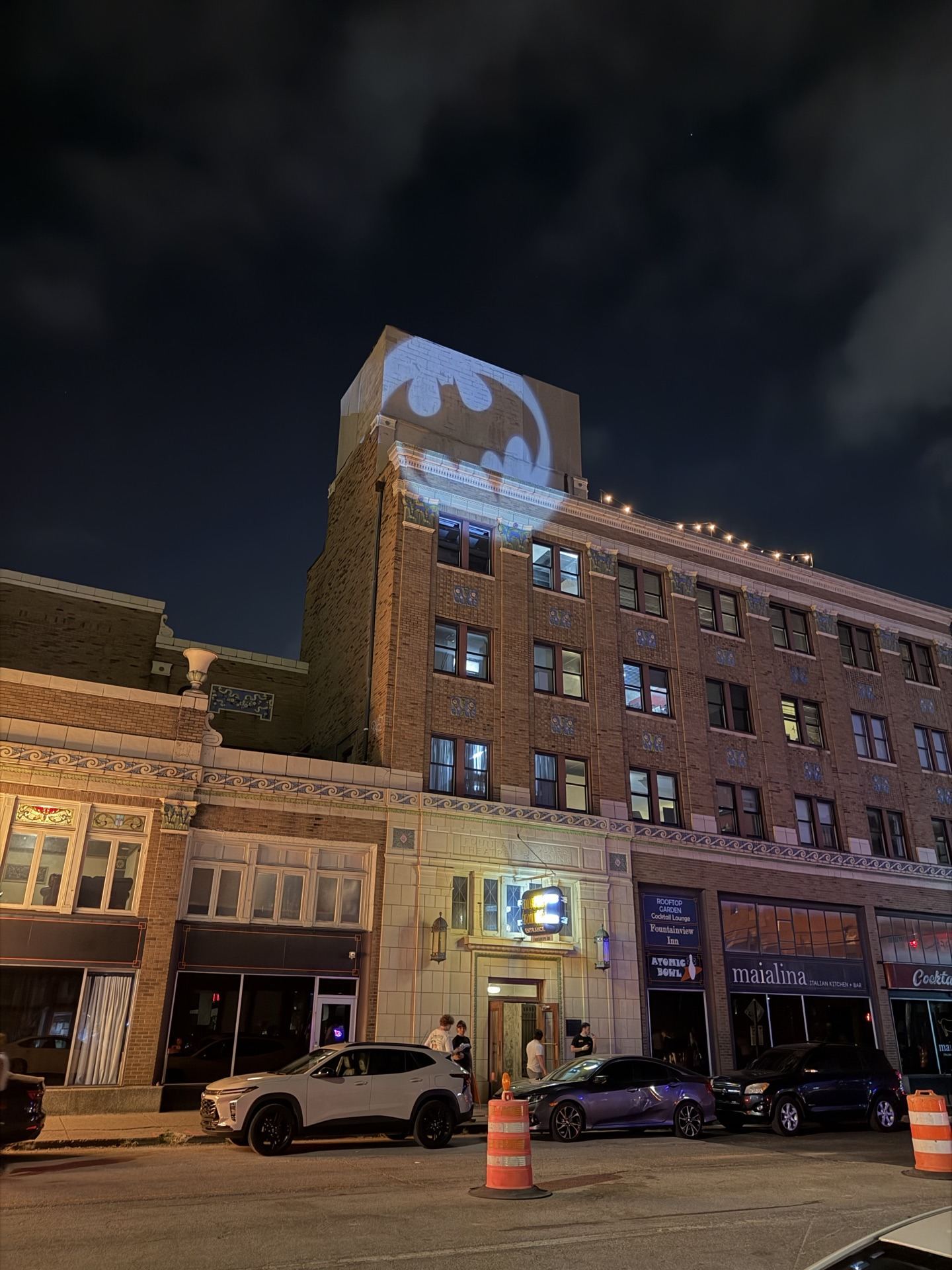 Historic building lit up at night in downtown Indianapolis