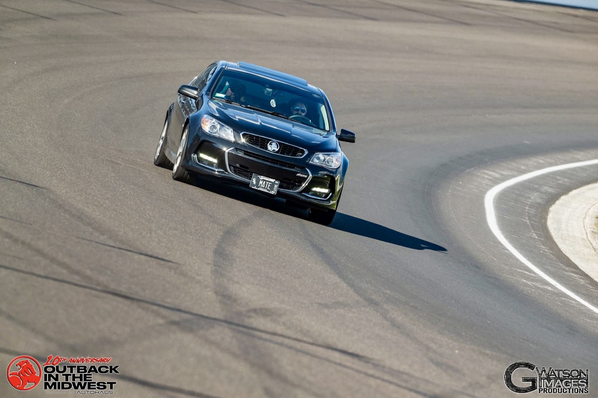 Professional on-track shot of the Chevy SS cornering hard at Indianapolis Motor Speedway