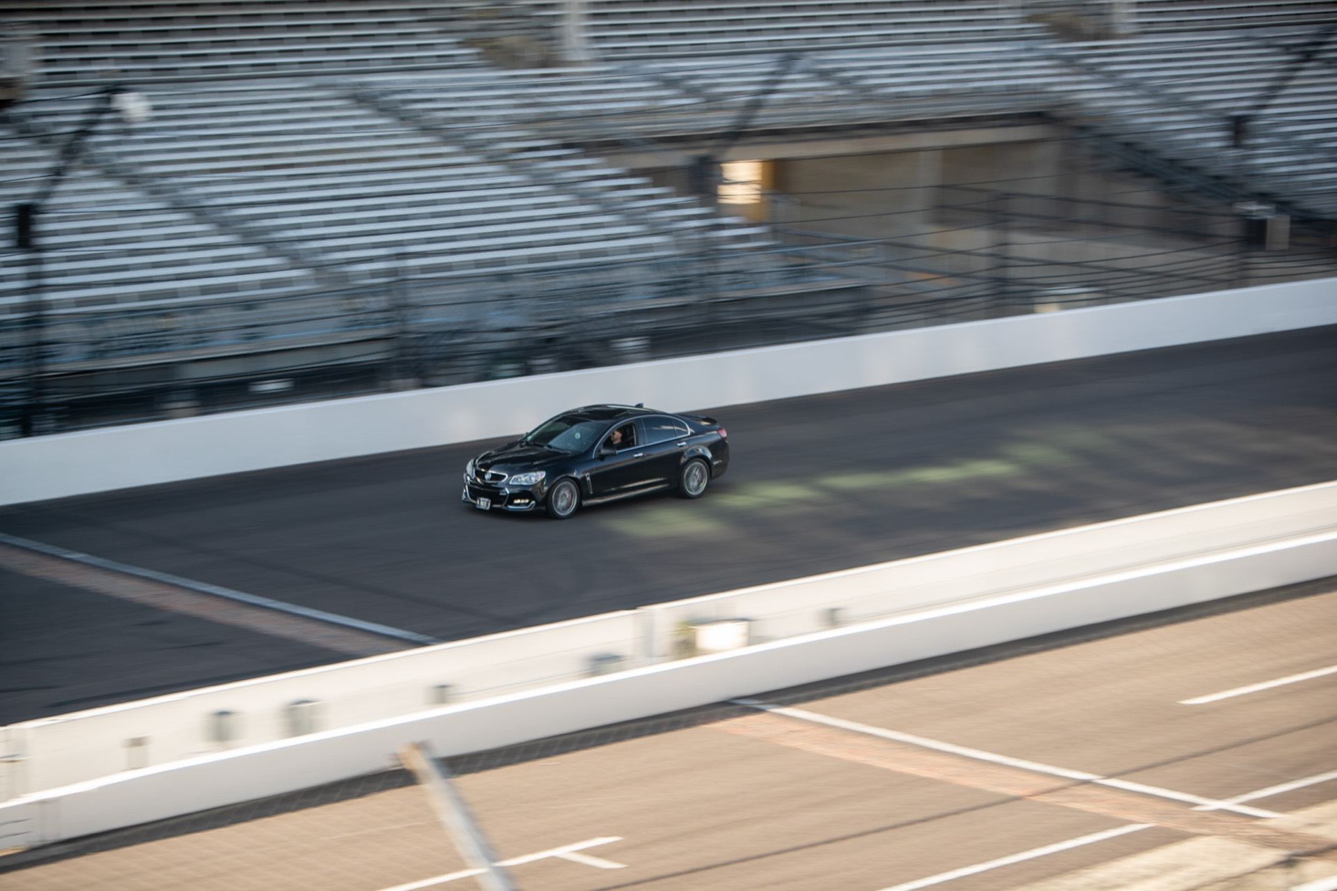 Candid panning shot of the Chevy SS on track taken from a pedestrian bridge